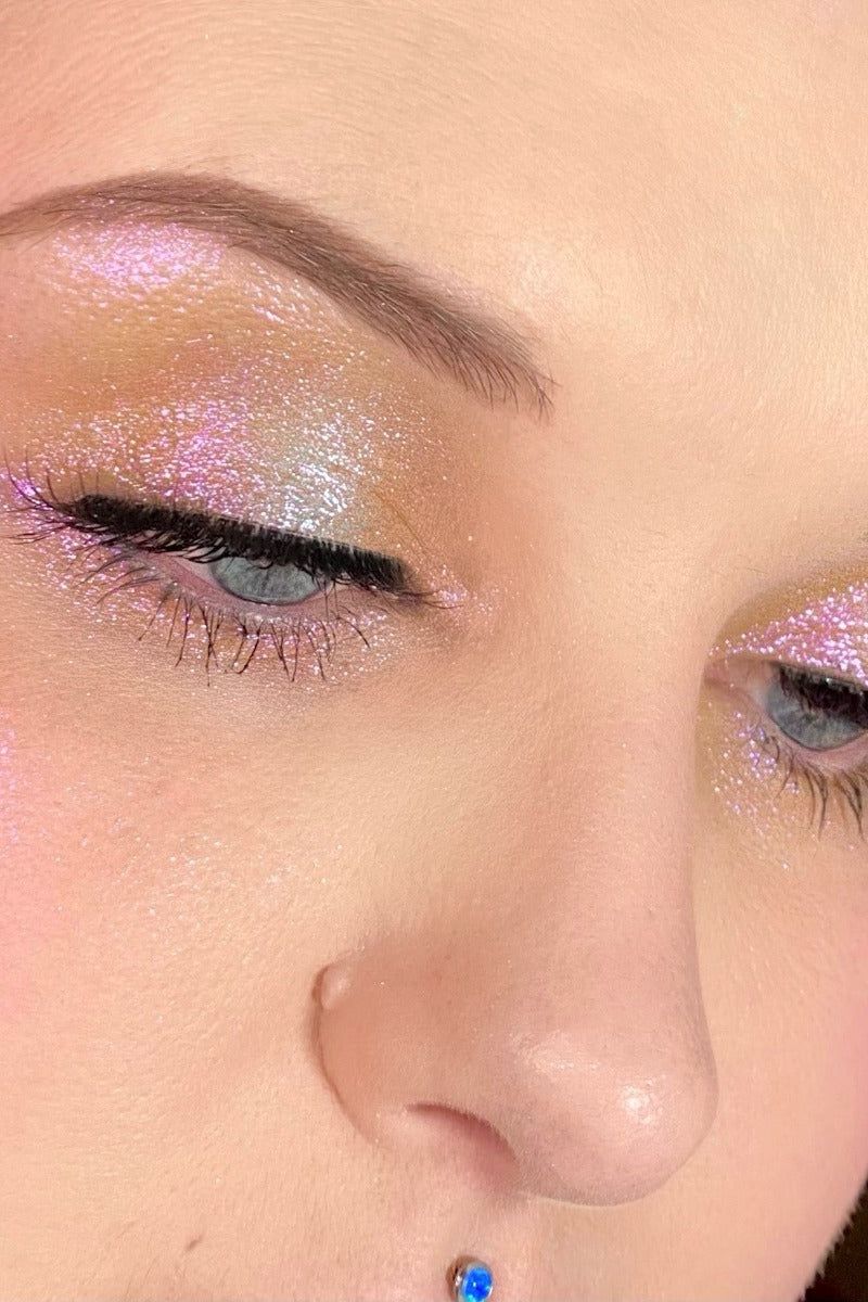 urban decay glitter dupe swatched on eyes