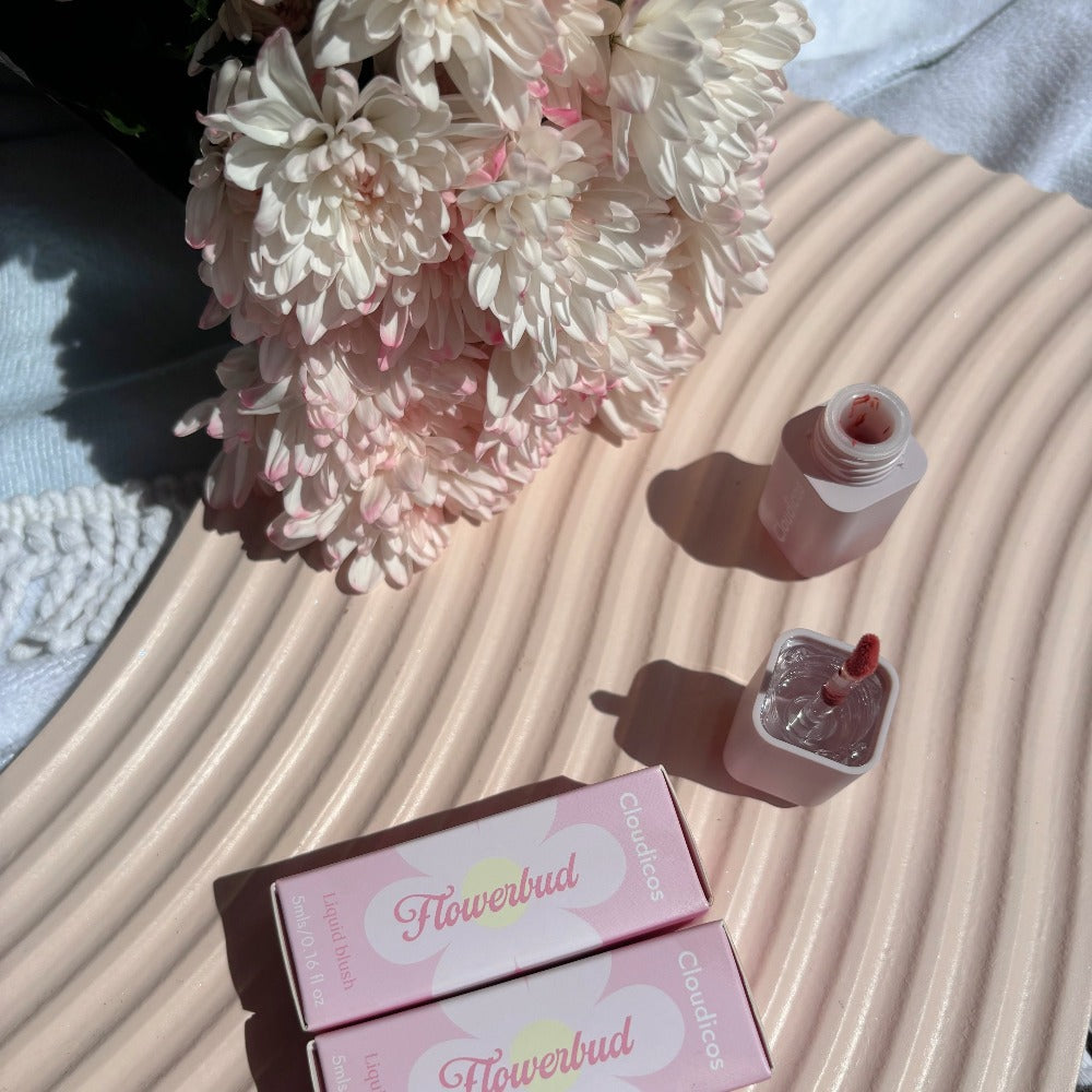 liquid blush flatlay aesthetic with box packaging