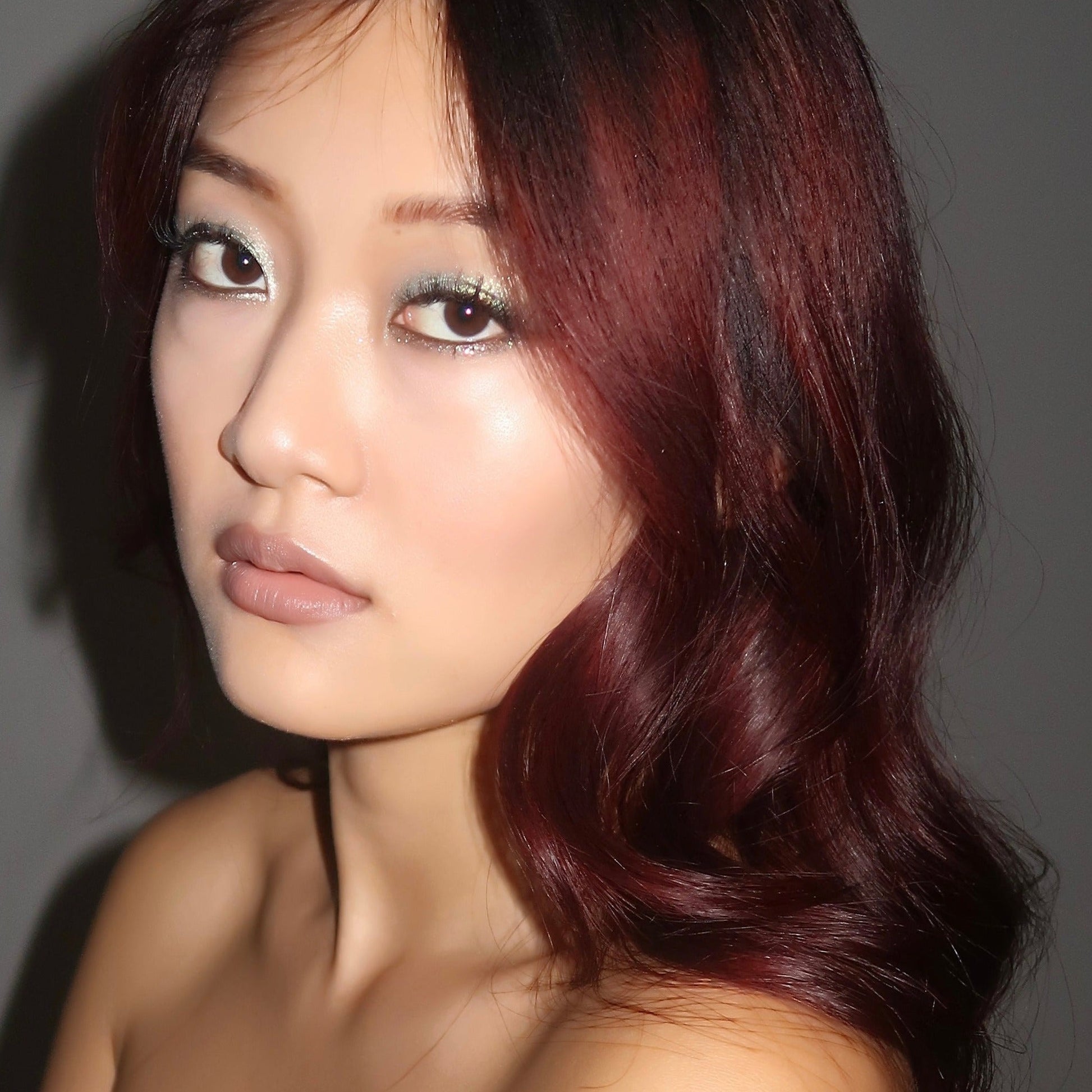 minty green eyeshadow on cherry red hair asian skin tone