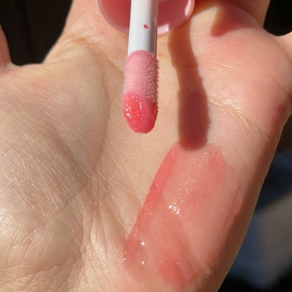 coral pink sparkly lip oil by cloudicos