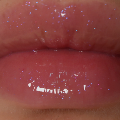 fairydust holographic unicorn pink purple sparkly glitter lip gloss on pale skin swatched on lips